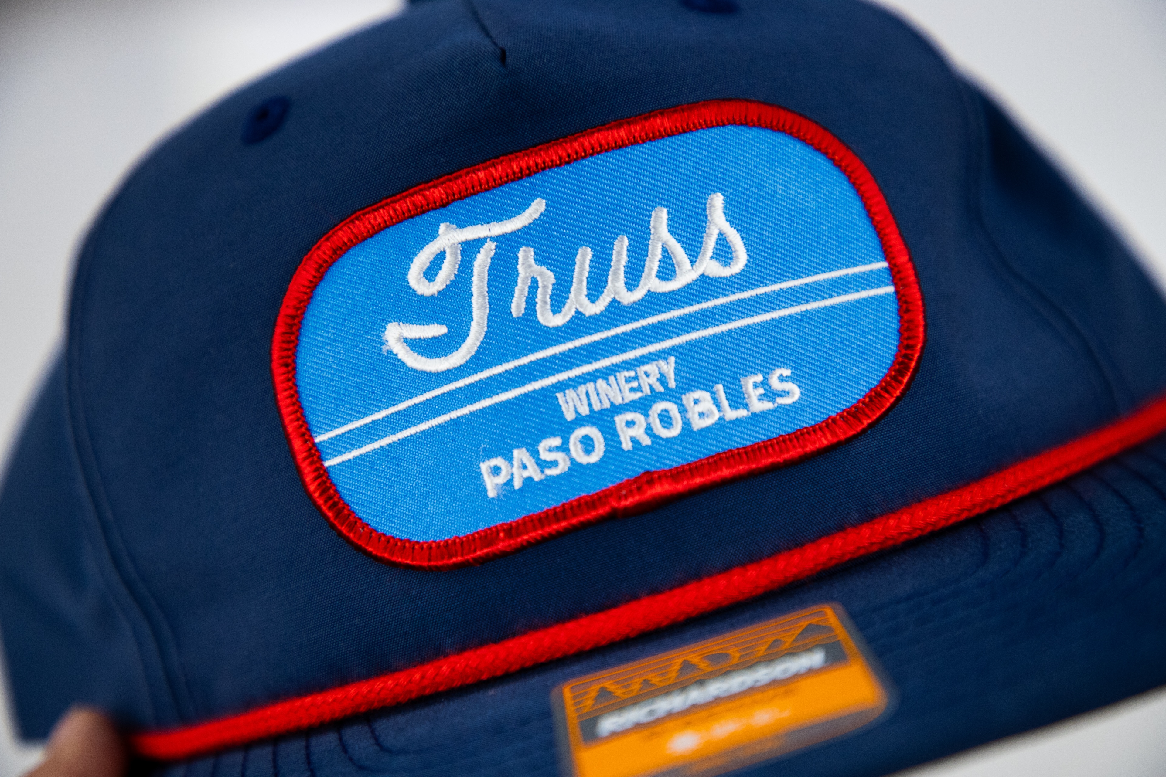 Custom embroidered patch hat for Truss Winery Paso Robles with detailed stitching and raised border