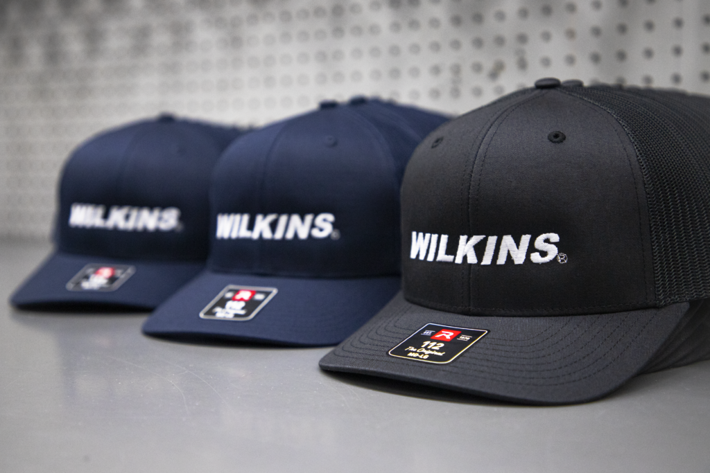 Bulk order of custom embroidered Richardson 112 trucker hats with company logo