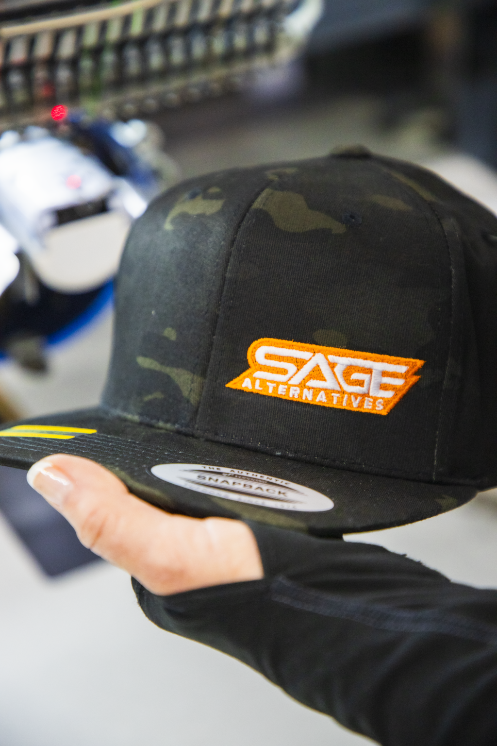 Custom embroidered design for Sage Alternatives on camouflage cap