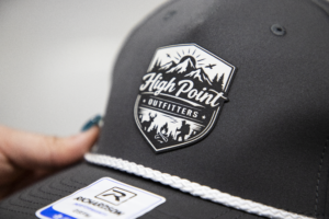 Custom leather patch hat with High Point Outfitters logo on Richardson cap