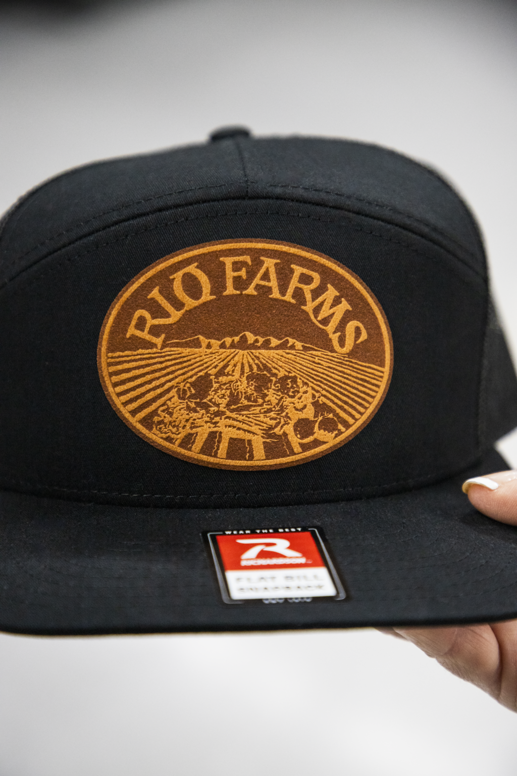 Custom printed logo for Rio Farms on black cap